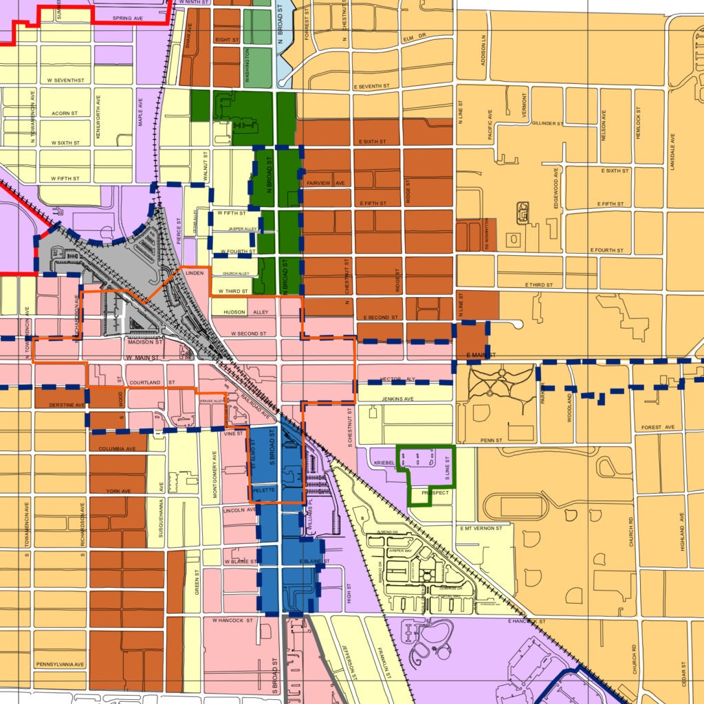 City map highlighting zoning areas with color-coded sections for residential, commercial, and mixed-use districts, showcasing urban planning details.